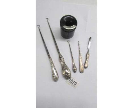 3 silver handled button hooks, two other silver handled items and a hair pot.