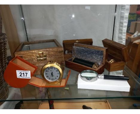 A cased brass sextant, 3 brass telescopes, a travelling clock and a magnifying glass