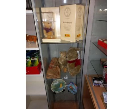 A limited edition boxed Steiff Winnie the Pooh and 2 Winnie the Pooh teddy bears with tags and 2 Winnie the Pooh plates