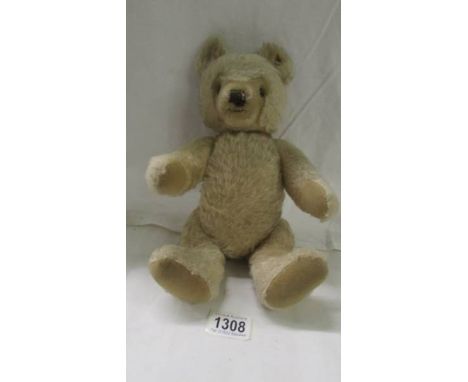 An old Steiff teddy bear, with button in ear. Condition report; Some foxing to paw pads, some rusting to ear button, no rips 