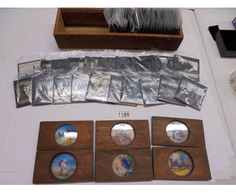 Approximately 40 magic lantern slides and six others in wooden frames.
