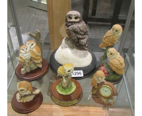 Six owl figures including a clock.