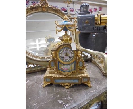 A French style ormolu clock with Sevres panels.