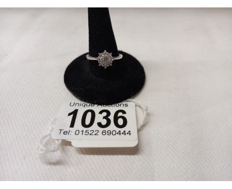 A half carat floral diamond white gold ring, size P, 2.5 grams.
