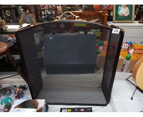 A modern brass and mesh fire screen. COLLECT ONLY