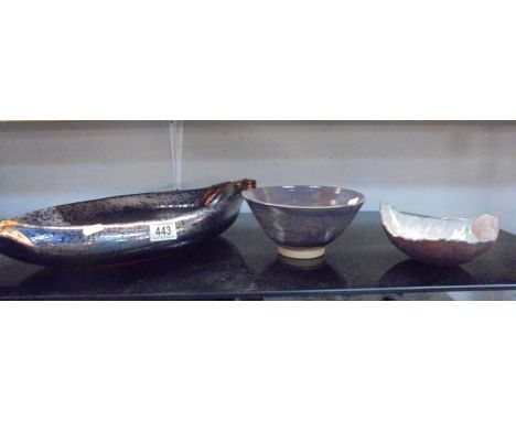 A large mottled glass bowl and two ceramic bowls.