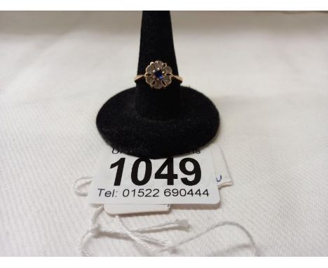 A topaz and sapphire 9ct gold ring, size M, 1.8 grams.