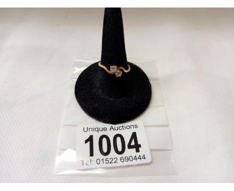 An 18ct gold ring set white stones, size K half, 2 grams.