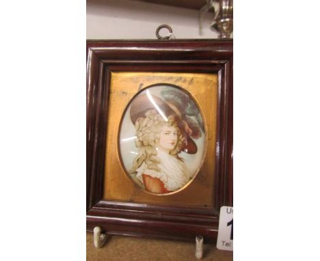 A framed and glazed miniature portrait of a lady.
