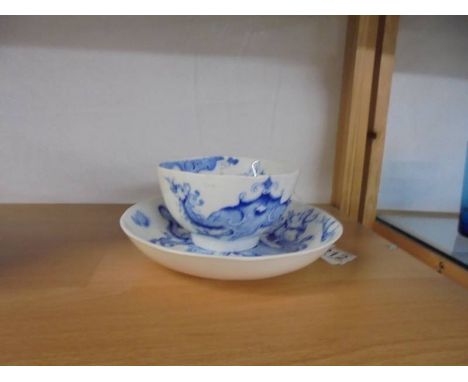 A Graingers of Worcester blue and white dragon decorated tea cup and saucer.