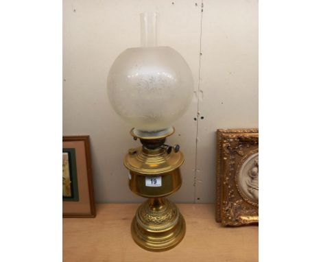 A Victorian brass oil lamp with later etched glass shade. COLLECT ONLY.