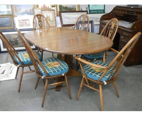 A good quality Ercol dining table with an extra leaf and six Ercol dining chairs, COLLECT ONLY.