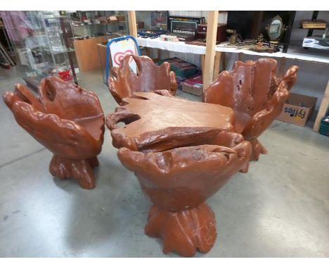 A 5 piece carved tree trunk garden set with 4 swivel chairs & a tableTable 109cm x 108cm x height 59cmChairs 75cm x 60cm x he