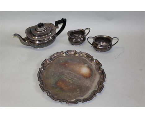 Garrard and Co Ltd plated tea service, with gadrooned bodies consisting of teapot, milk jug, sugar bowl and tray with present