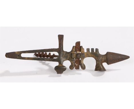 Unusual early 20th Century multi tool, cast iron tools include corkscrew, glass cutter, tack lifter, screw driver, bottle ope