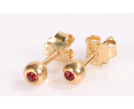 Pair of 18 carat gold and ruby set earrings