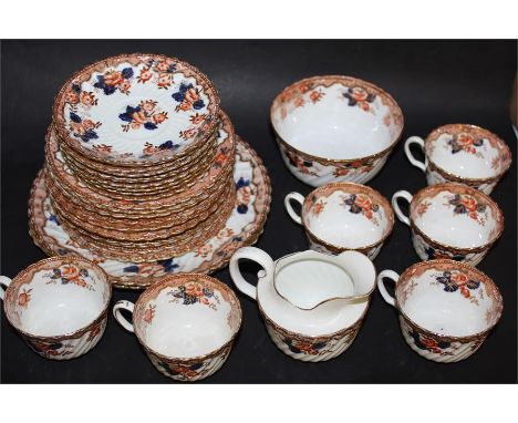 E Hughes & Co imari pattern tea service, consisting of eleven tea cups, twelve saucers, twelve side plates milk jug, sugar bo