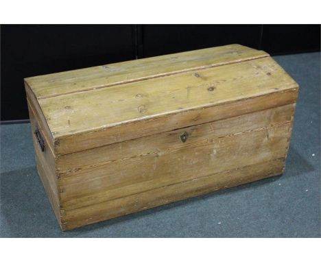 19th Century pine trunk, the dome top enclosing storage space with tapering sides flanked by carrying handles, 87cm wide