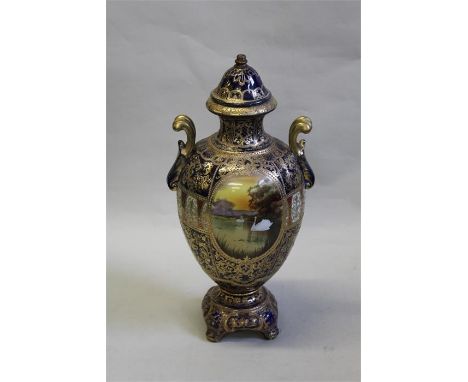 Table lamp base richly decorated in gilt and blue with central cartouche depicting a swan