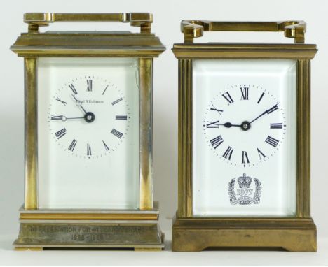 A 1970s brass 8 day carriage clock, commemorating the Queens' Silver Jubilee, together with a later English 8 day example. (2