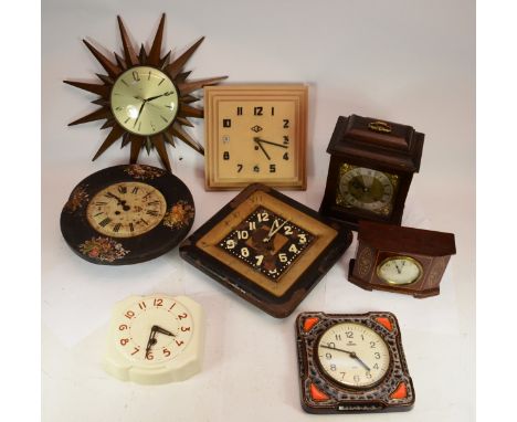 A collection of mid 20th century and later wall clocks and mantel clocks, having manual and quartz movements. 