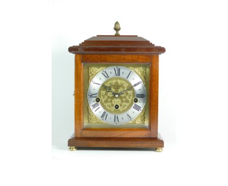 A modern mahogany bracket clock, the chased brass dial with silvered chapter ring, housing a Franz Hermle jewelled 8 day move