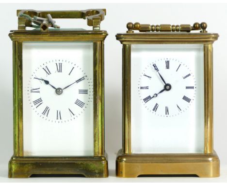 A brass 8 day carriage clock, the movement striking on bell, together with an unnamed example. (2) 