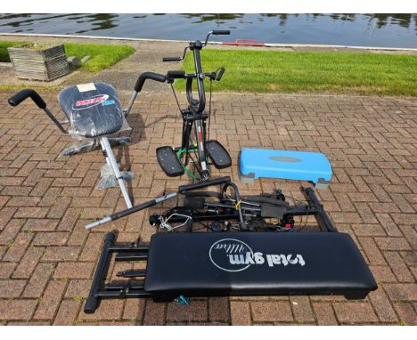 A Total Gym Ultra machine, an Instant Abs machine, a Mini Mobility Trainer and a step 