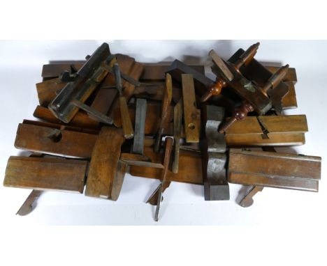 A collection of early 20th century carpenters tools, to include molding planes, chizels, and box planes. (2) 