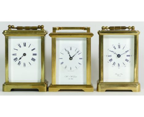 An English brass 8 day carriage clock, together with two unnamed examples. (3) 