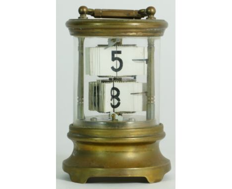 An early 20th century brass ticket clock.13.5cm tall. 