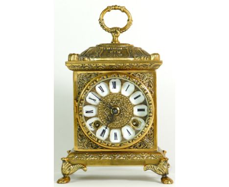 A German made brass bracket clock, having an 8 day movement striking on bell. 23cm tall.