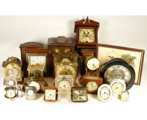 A collection of mid 20th century and later mantel clocks, anniversary clocks, wall clocks and barometers, having manual and q