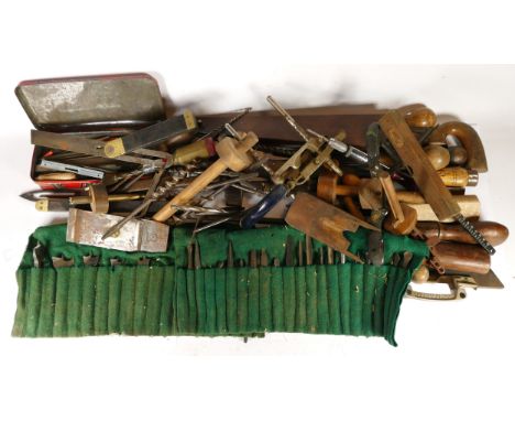 A collection of early 20th century and later carpenters hand tools, to include multi planes, chizels, drills, rebate planes, 