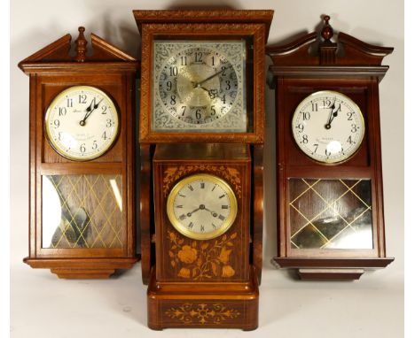A collection of early 20th century and later mantel clocks and wall clocks, having manual and quartz movements. (2) 
