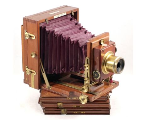 Lancaster "The 1891 Patent Instanograph". Wood and brass 1/2 plate field camera with maroon bellows (condition 5F) with Lanca