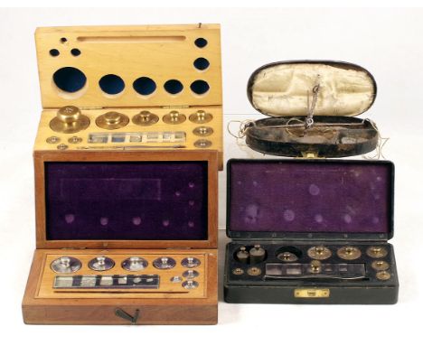 3 Set of Postal Weights & a Pair of Guinea Scales. All in fitted boxes, 1 weight set with replacements. Guinea scales missing