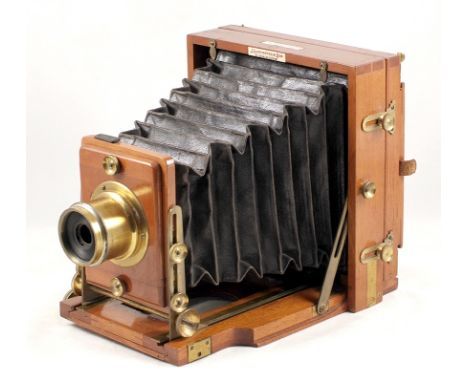 Lancaster "The 1897 Patent Instanograph". Wood and brass 1/2 plate field camera (condition 5F) with Lancaster lens. Also 2 DD