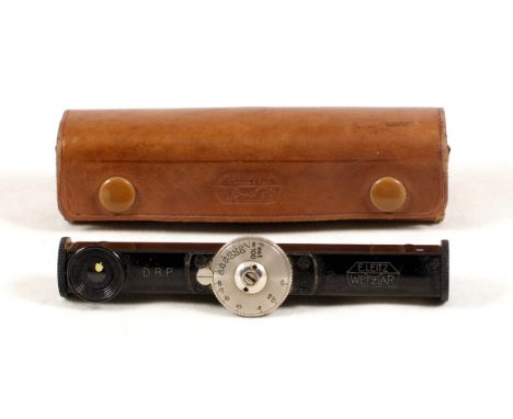 Black Leitz Fodis rangefinder, small dial version marked in feet (condition 4F) in makers case.