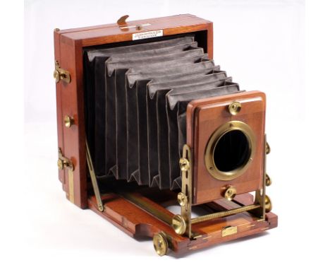 Lancaster "The 1897 Instanograph" wood and brass 1/2 plate camera (condition 5F), no lens.