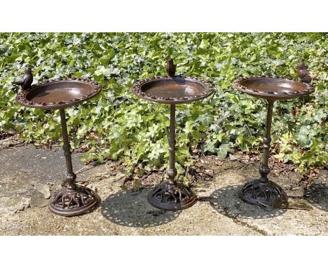 BIRD BATHS, a set of three, vintage style cast metal, each with a perching bird, 33cm H (3) 