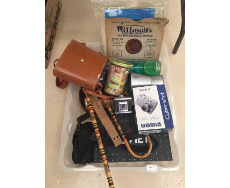 A box of odds to inc a lava lamp, binoculars, cameras, books, records etc