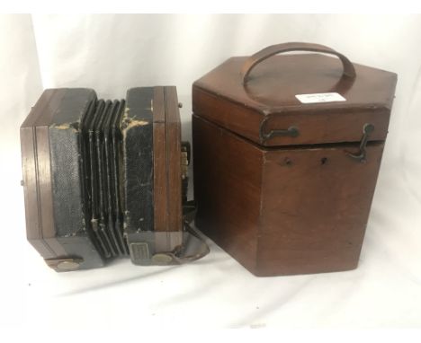A 19th century concertina, 48 button, bearing label for J Fogelquist 