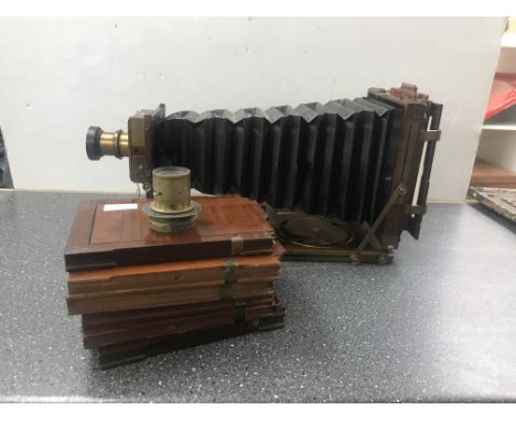 A Thornton Pickard Royal plate camera with S B Patent, seven plate holders and two lenses, one 8x5, by Beck Ltd and the other