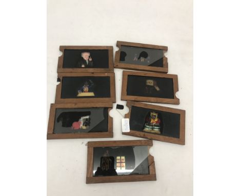 Seven (7) hand-painted moving Magic Lantern slides
