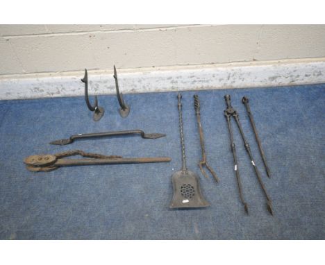 A PAIR OF VICTORIAN CAST IRON ANTI CLIMB SPIKES, a door handle, a chain pipe wrench, along with four various companion set pi