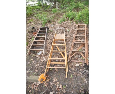 THREE VINTAGE WOODEN STEP LADDERS including one with lattice sides 145cm high (3)