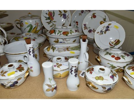 THIRTY THREE PIECES OF ROYAL WORCESTER EVESHAM DINING WARE, including serving dishes, plates, tea pots, casserole dishes, sal