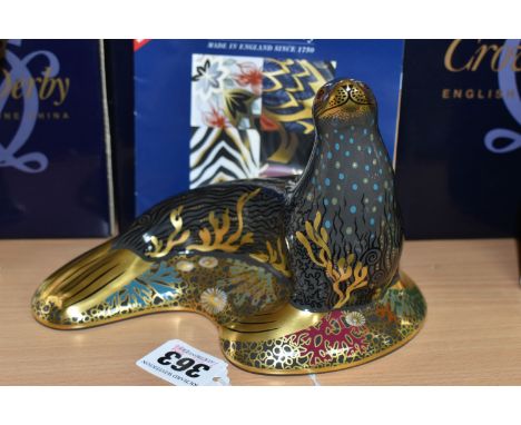 A BOXED ROYAL CROWN DERBY 'SEA LION' PAPERWEIGHT, with gold stopper, gold printed backstamp and date code for 2009, height 11