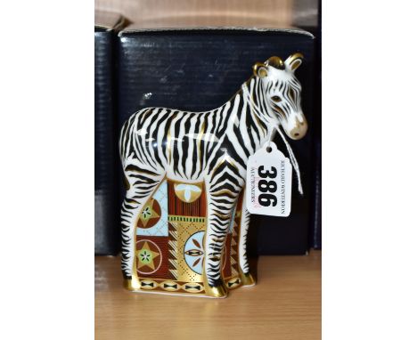 A BOXED ROYAL CROWN DERBY 'ZEBRA BABY' PAPERWEIGHT, with gold stopper, red printed backstamp and date code for 2009, height 1